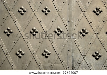 background of metal blacksmith handmade decorative doors . ancient architecture of castle gate backdrop.
