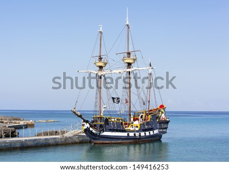 The pirate ship docked near Grand Cayman island, the popular tourist attraction in Caribbean (Cayman Islands).