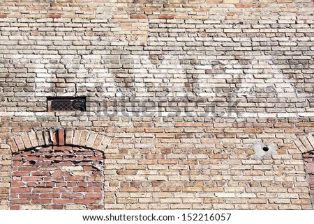 The word \'Tampa\' written on a brick wall in Tampa city downtown (Florida).