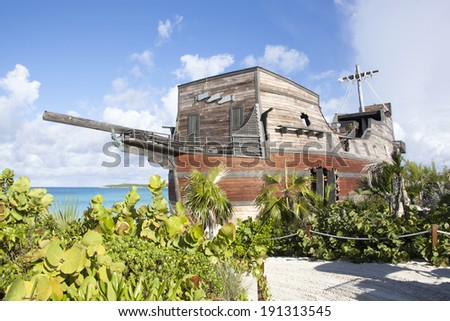 The original bar built in a shape of a pirate ship standing on Half Moon Cay island in The Bahamas.