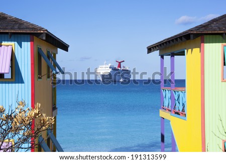 Colorful Bahamian houses with a cruise ship in a background (Half Moon Cay).