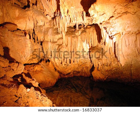 The underground water with stalactites inside Crystal & Fantasy caves in Bermuda.