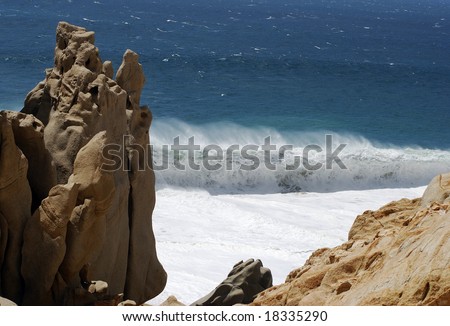 Furious wave is breaking down on Lovers\' beach in Cabo San Lucas, Mexico.