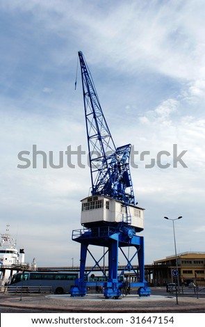 The blue crane standing at the entrance to Malaga city port (Spain).