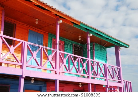 The wooden house painted in characteristic Caribbean bright colors in Mahahual resort town (Mexico).