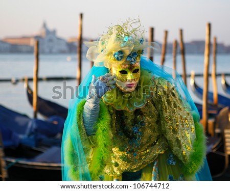 VENICE, ITALY - FEB 18: Unidentified person in Venetian mask at St. Marco Square, Carnival of Venice on February 18, 2011.