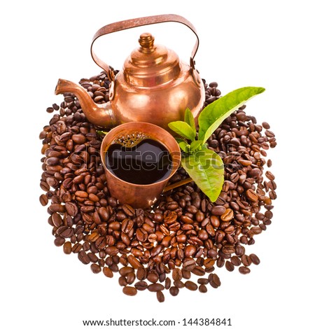 coffee beans, copper kettle and a copper cup of freshly brewed black coffee isolated on white background