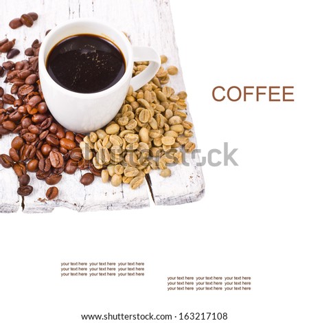 freshly brewed black coffee in a white cup and grain unground coffee on white boards isolated on white background