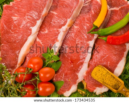 fresh meat - fresh steaks and fresh herbs and vegetables