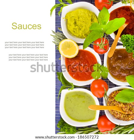 fresh vegetables and herbs and cooking sauces in white bowls isolated on a white background with sample text