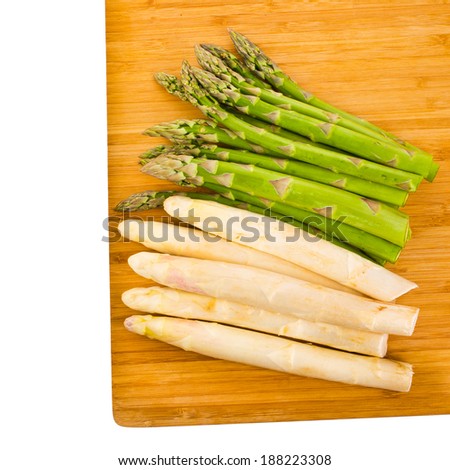 large white asparagus green asparagus are on the board  isolated on white background