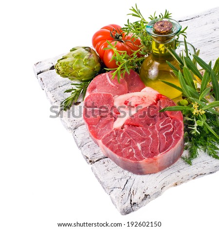 meat, a large piece of fresh meat, beef, to be on the board, decorated with greens and vegetables isolated on white background