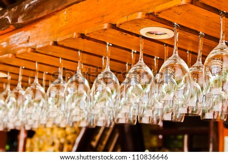 hanging wine glasses in a bar