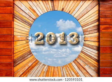 new year 2013 concept in Vintage wood pattern texture with blue sky background