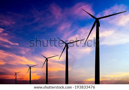 wind turbine silhouette on colorful sunset abstract for green earth concept