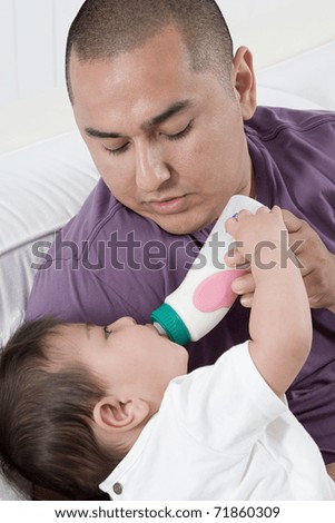 Dad Feeding Baby