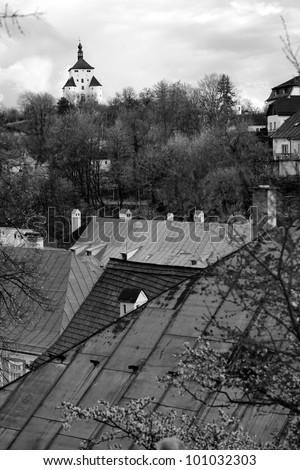 New Castle above roofs in center of Banska Stiavnica, Slovakia (black and white image)