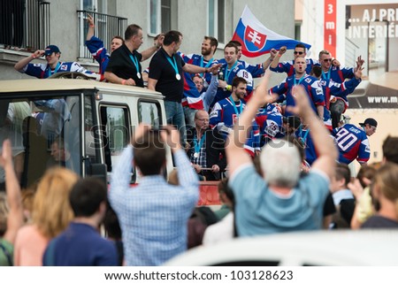 BRATISLAVA, SLOVAKIA - MAY 21: Fans and supporters of Slovak ice hockey team celebrate their silver heroes during bus trip through the city on May 21, 2012 in Bratislava, Slovakia