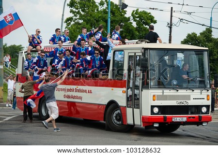 BRATISLAVA, SLOVAKIA - MAY 21: Bus full of Slovak ice hockey players celebrating the silver medal win in men\'s World Ice Hockey Championships goes through the city on 5/21/2012 in Bratislava, Slovakia