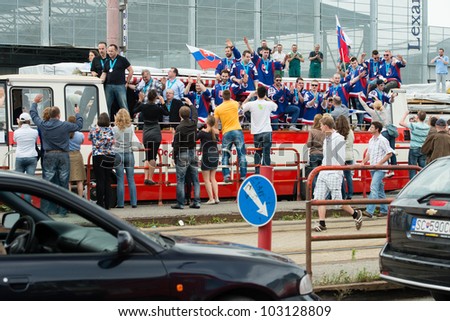 BRATISLAVA, SLOVAKIA - MAY 21: Slovak ice hockey players celebrate the silver medal win in men\'s World Ice Hockey Championships in the streets of Bratislava on May 21, 2012 in Bratislava, Slovakia