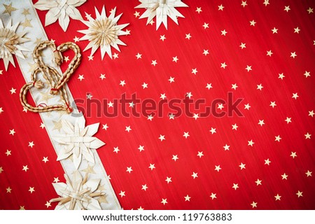 Christmas greeting card with Christmas decorations on a red background with stars