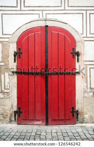 red historical wooden locked door