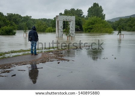 DEVIN, SLOVAKIA - JUNE 3: High water level on the Morava river starts to cover Communist Regime Victims Monument on June 3, 2013 in Devin