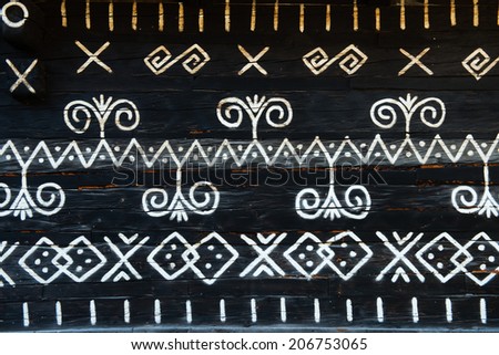 painted pattern on side of log house in Cicmany, UNESCO World Heritage Site, Slovakia