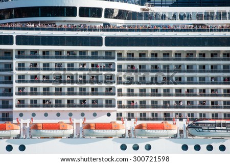 VENICE, ITALY - SEPTEMBER 14, 2014: MSC Fantasia cruise ship with passengers floats in Venice, Italy. MSC Fantasia is the largest cruise ship ever built for a European ship owner.