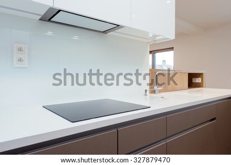 Detail of induction cooker in contemporary kitchen