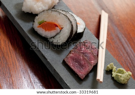 Sushi from whale meat served on the black board