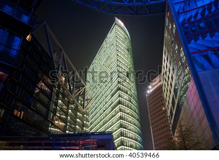 Berlin commercial center with modern office building in the night, Germany