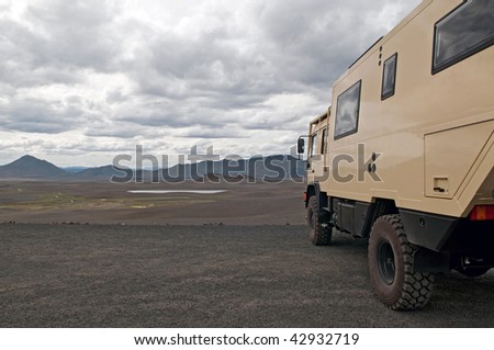 tourist truck with volcanic landscape of Iceland