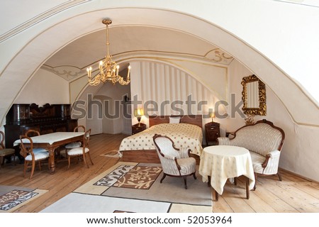 interior of a luxurious old style hotel room