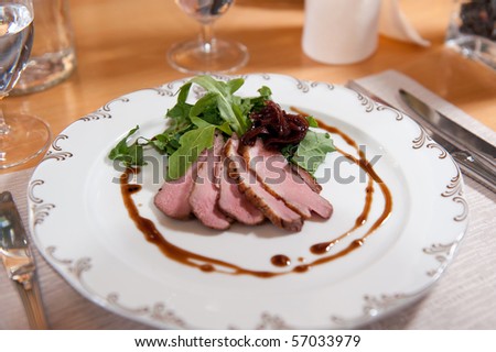 Delicious lightly smoked duck breast with pickled red onions and fresh herbs