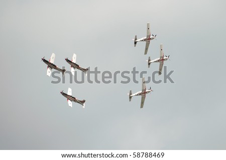 KECSKEMET, HUNGARY - AUGUST 8: two groups Croatian Wings of Storm airplanes are crossing at close distance at Airshow August 8, 2010 in Kecksemet, Hungary