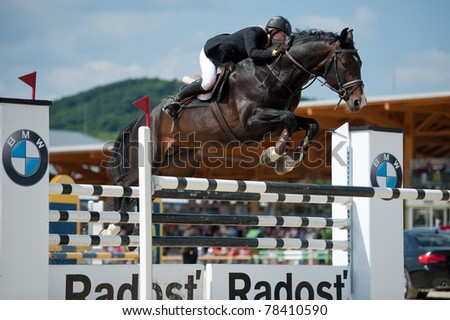 PEZINOK, SLOVAKIA - MAY 29: Veronika Jelinkova (CZE) on horse Forever jumps over a hurdle at SHARON Grand Prix CSI1* on May 29, 2011 in Pezinok, Slovakia