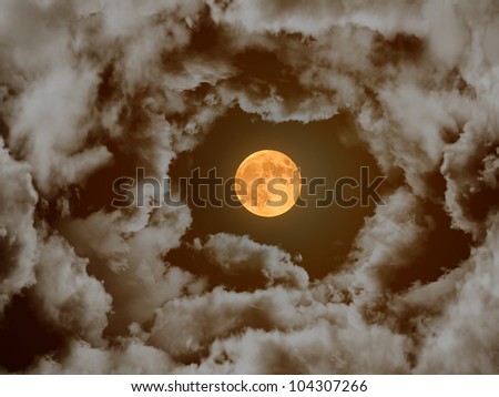 Full moon in a cloudy night