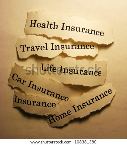 Torn paper with different types of insurance. Insurance concept.