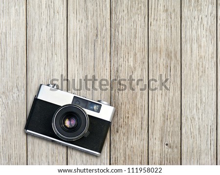 Vintage Photo Camera On A Wooden Table