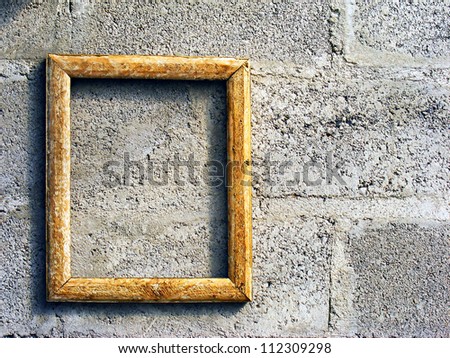 Empty old wooden frame on a wall