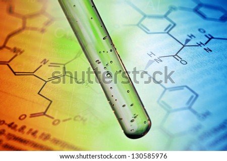 Air bubbles in test tube with liquid material.
