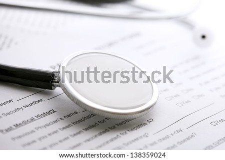 Stethoscope on a medical form. Medical concept.
