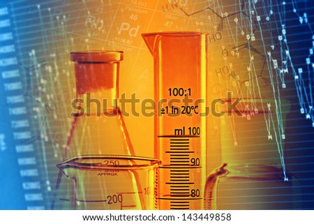 Laboratory glassware in yellow light. Science concept.