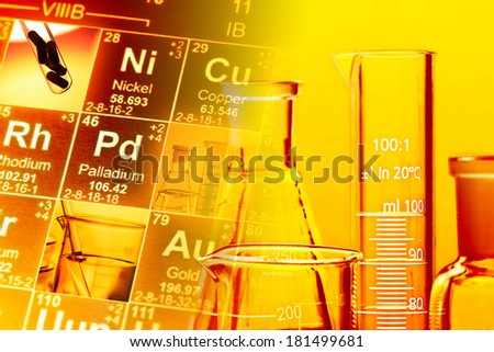 Laboratory glassware in yellow light. Science concept.