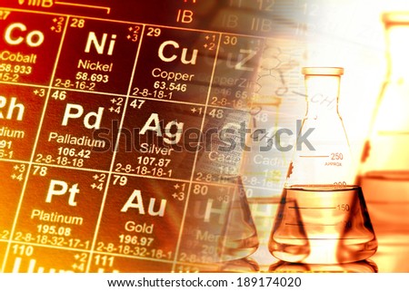 Laboratory glassware and periodic table of elements. Science concept.
