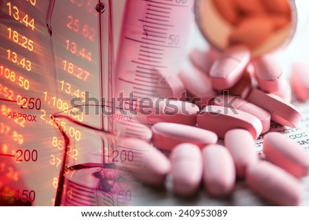 Pills scattered on paper with DNA data. Small depth of field.