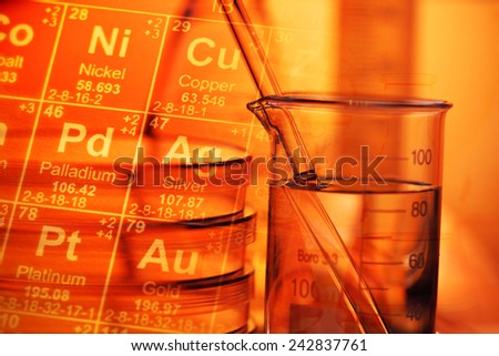 Laboratory glassware and periodic table of elements. Science con