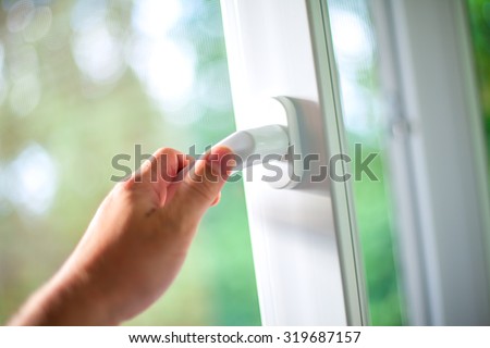 Arm open white plastic window.