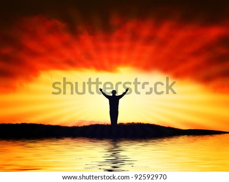 Man figure on sunshine with red sky background. Symbol of faith.